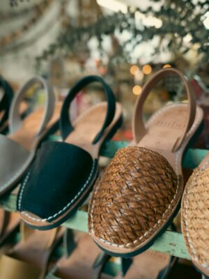 Close-up of stylish sandals on display in a boutique, highlighting craftsmanship.